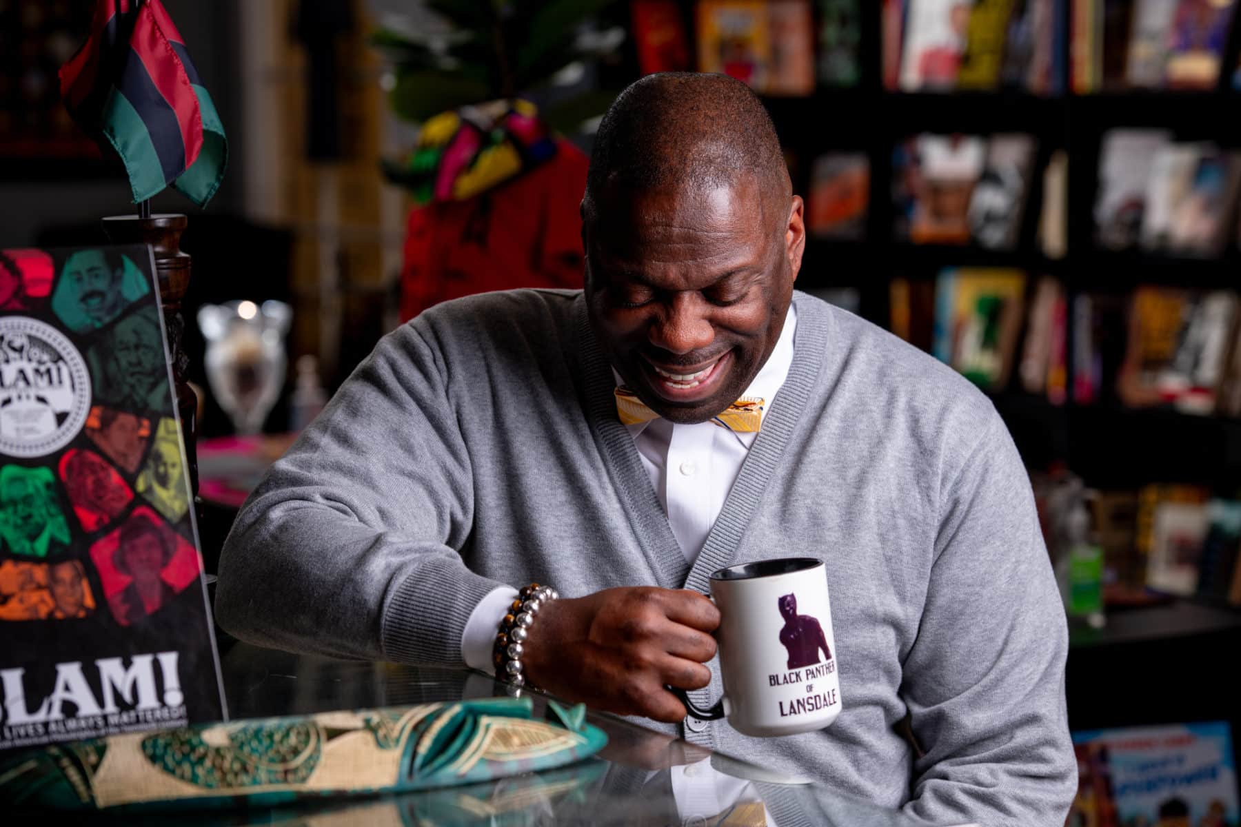 The Black Panther of Lansdale, Shaykh, laughs as we capture light hearted photographs of him in his store. 