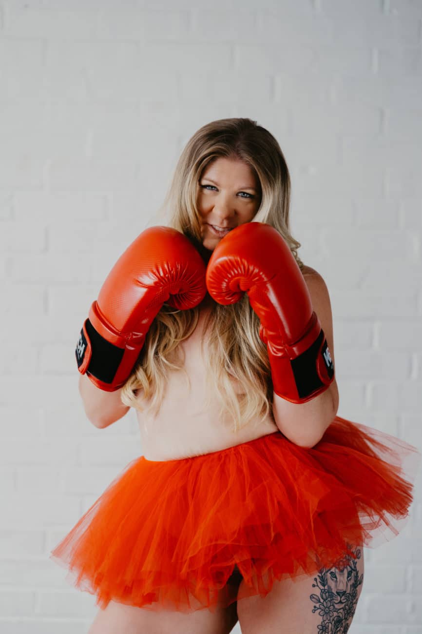 Red boxing gloves and matching red tutu, topless boudoir photo