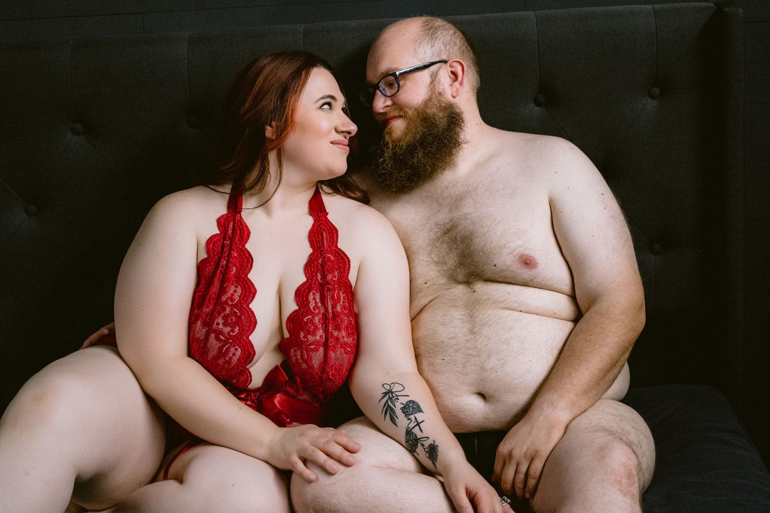 Tender moment during couples boudoir