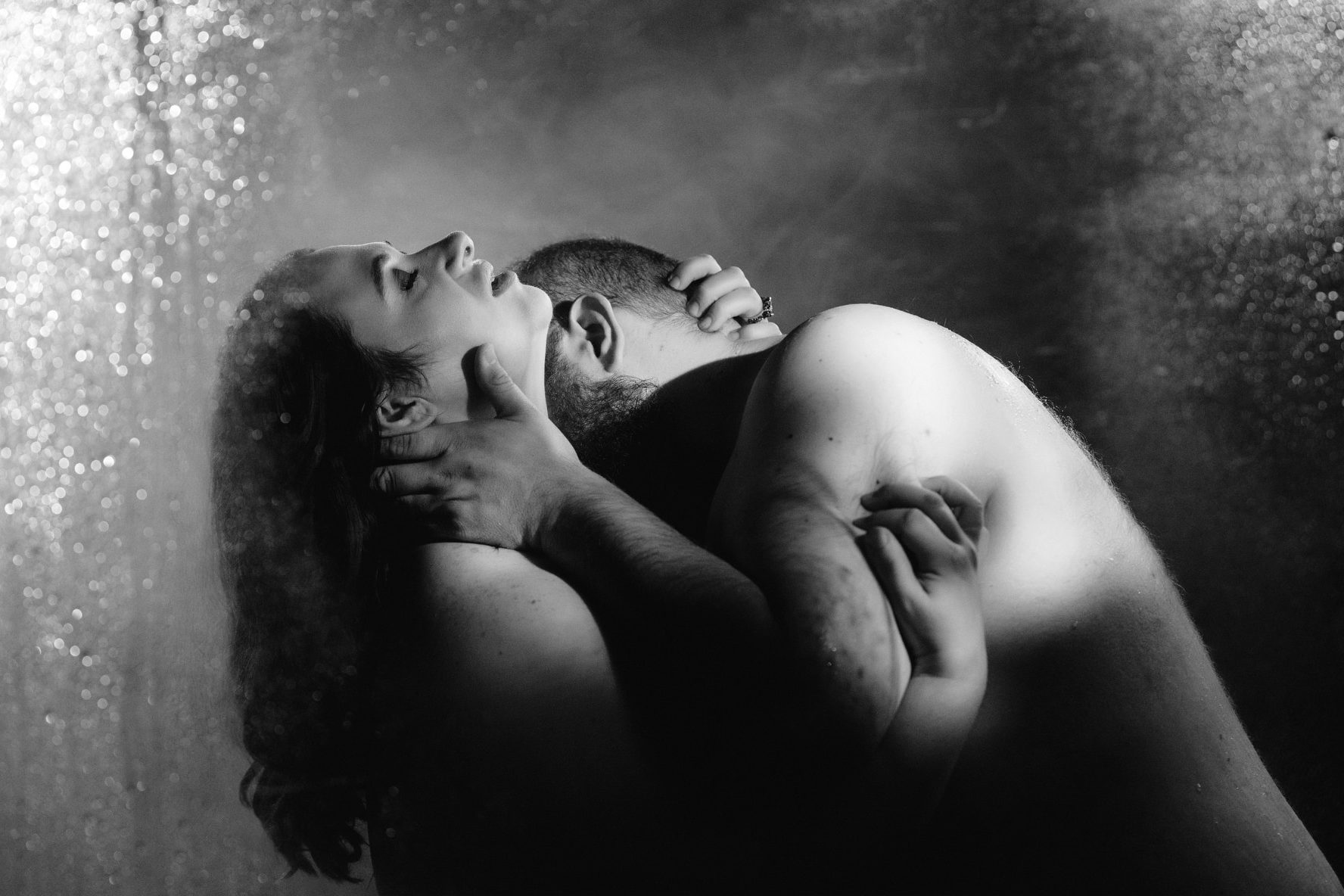 Steamy black and white couples boudoir shower scene