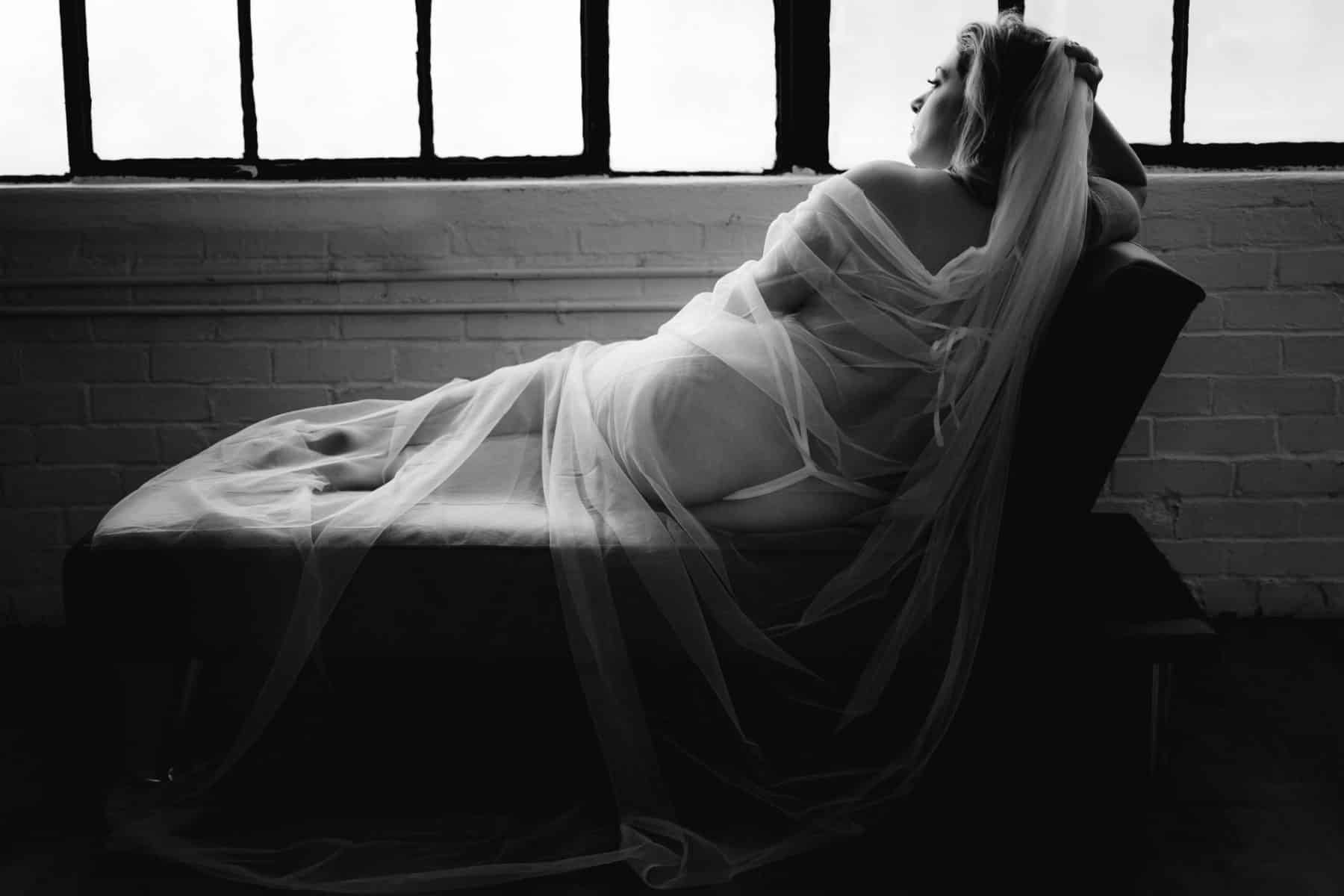 Bridal boudoir photo of nurse in lingerie, captured by Allebach Photography