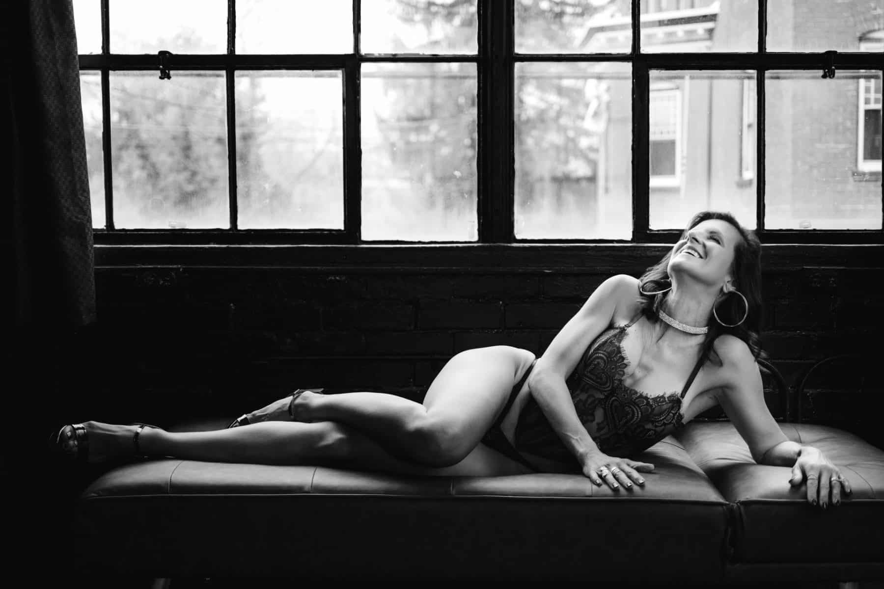 Empowered boudoir photo feeling beautiful and free