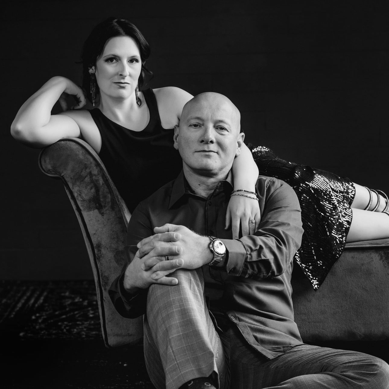 Black and white photo of a well dressed couple at the beginning of their anniversary couples boudoir session with allebach photography