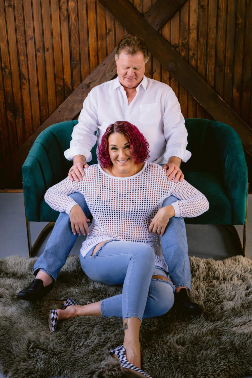 Empowered couple in their 60s posing confidently during a couples boudoir session.