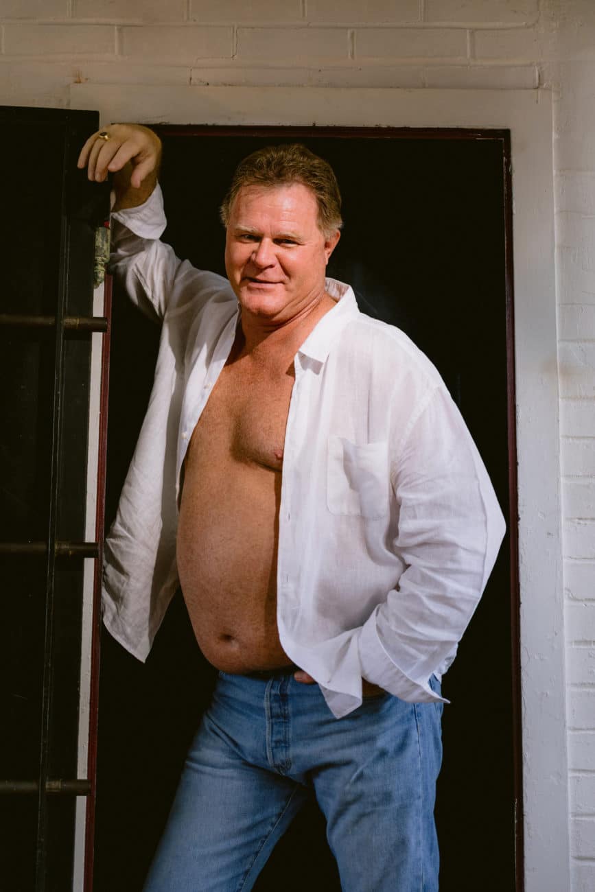 Empowered couple in their 60s posing confidently during a couples boudoir session.