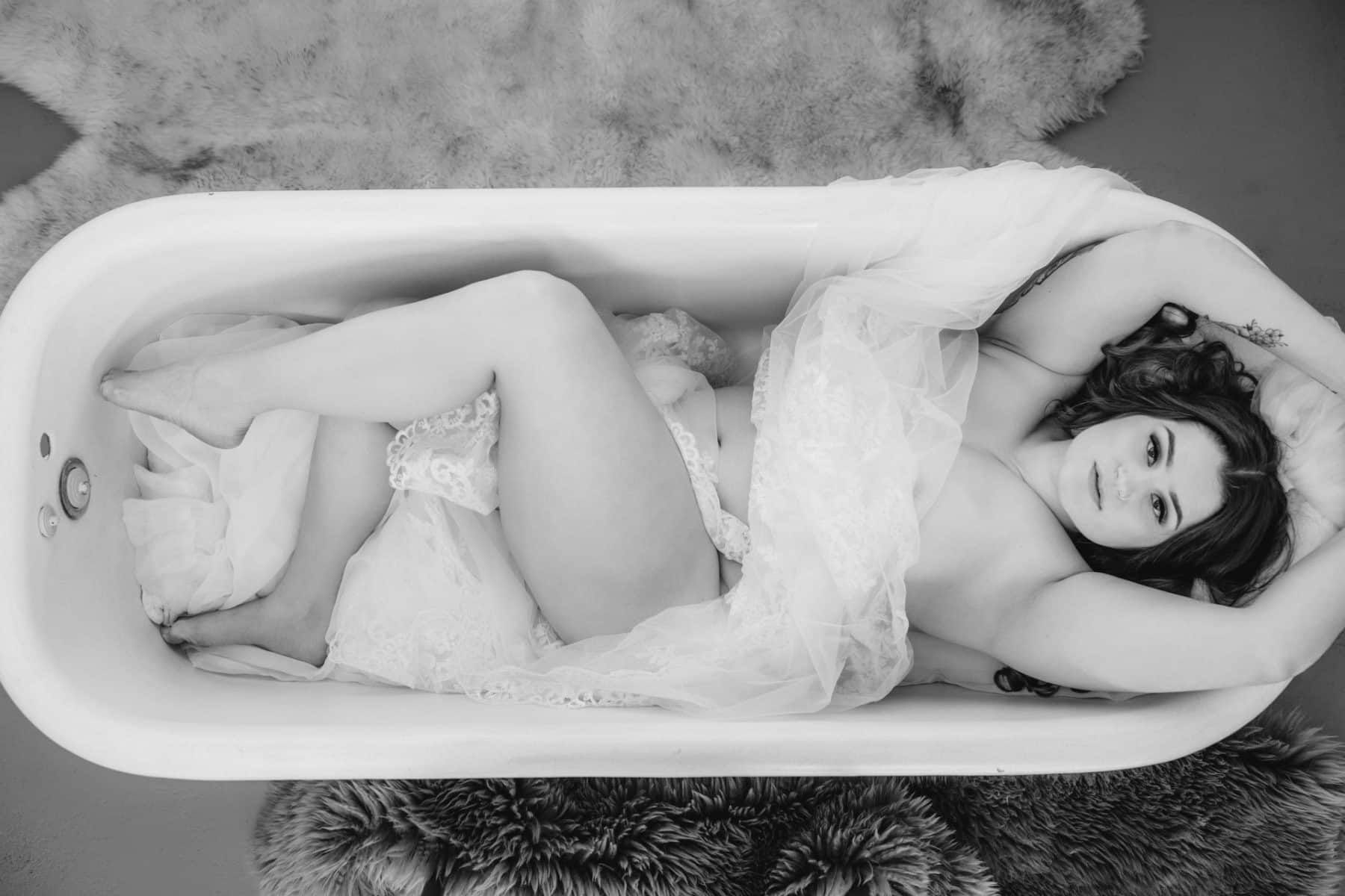 Bridal boudoir, cathedral veil nude in bathtub