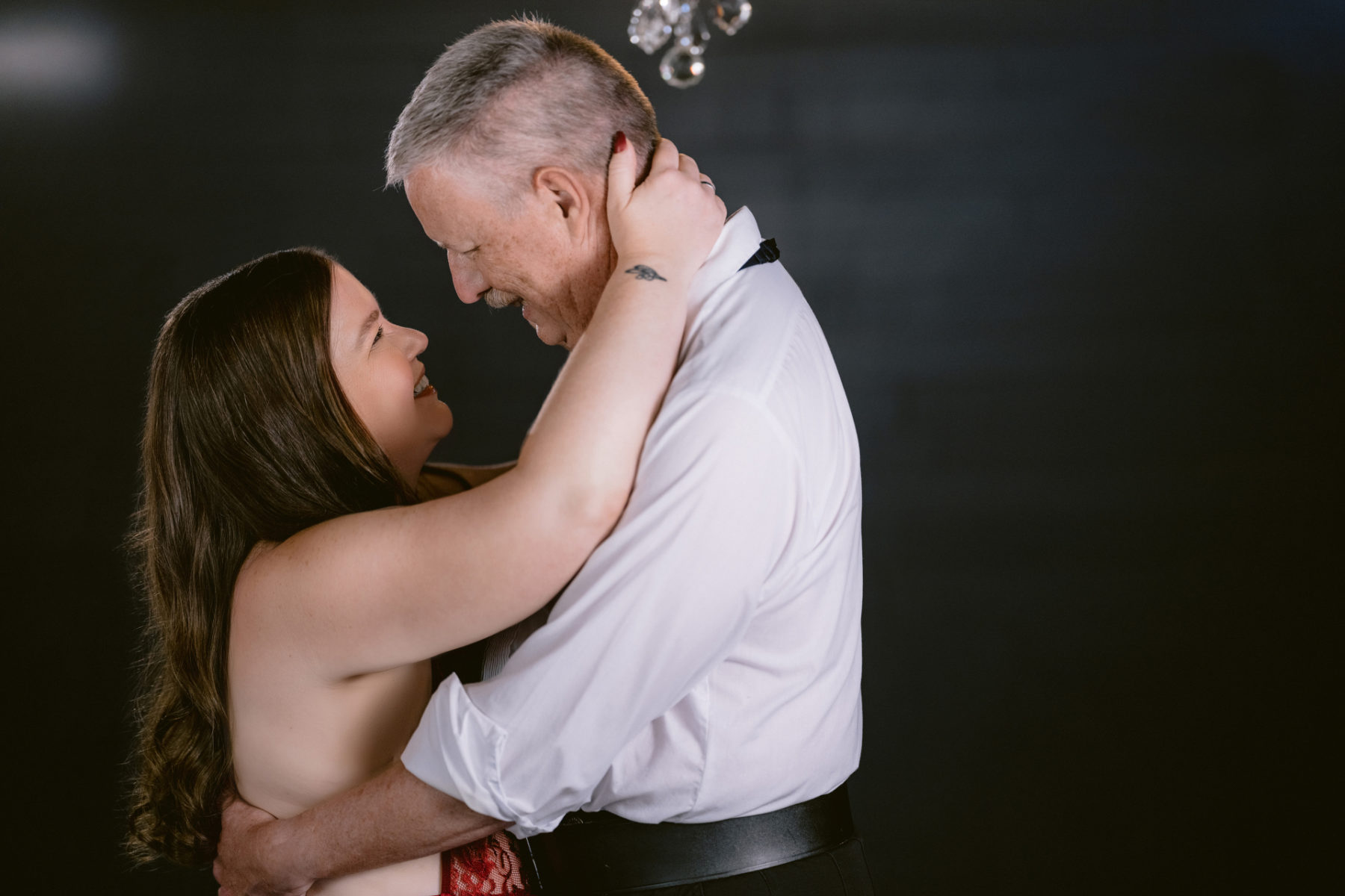 Loving couple embracing for an intimate boudoir session