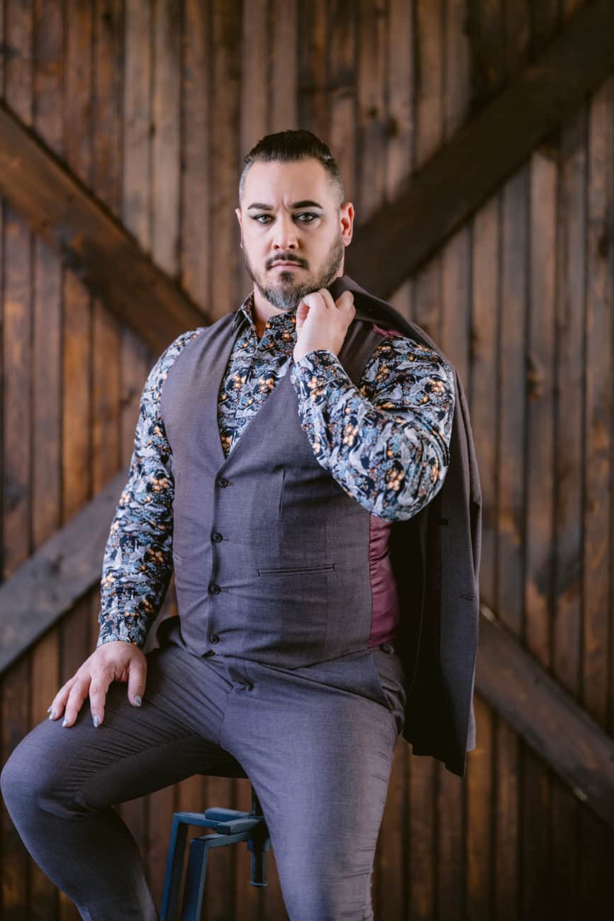 Dapper photo of gay man in floral shirt and grey vest